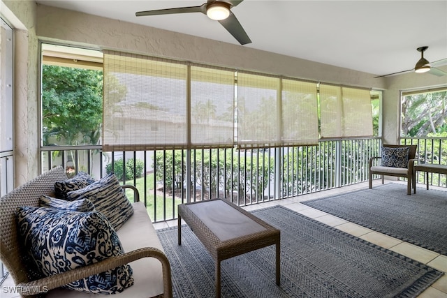 sunroom featuring ceiling fan