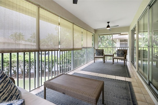 sunroom with ceiling fan