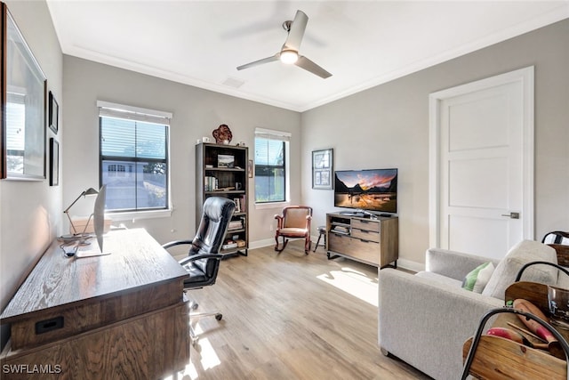 office space with ceiling fan, light hardwood / wood-style flooring, and crown molding