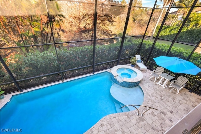 view of swimming pool featuring a patio, glass enclosure, and an in ground hot tub