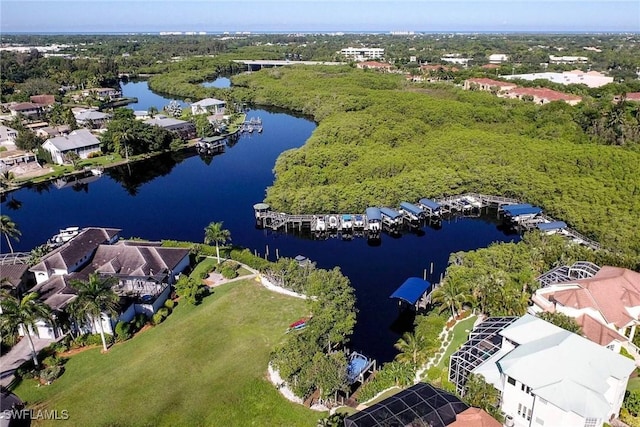 birds eye view of property with a water view