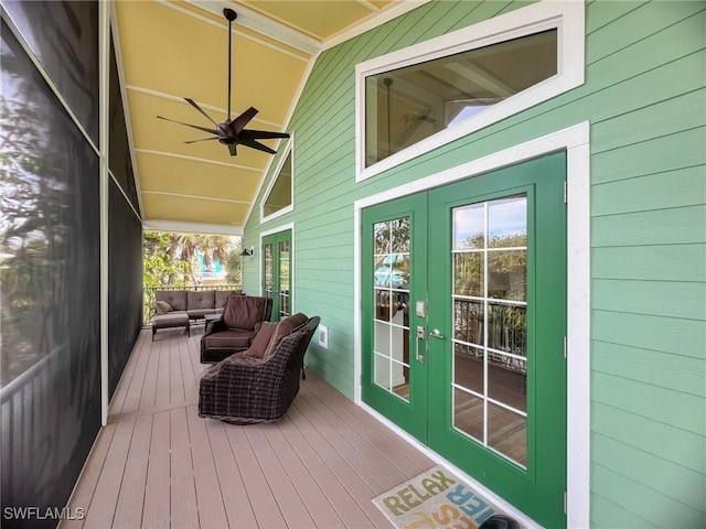 wooden deck featuring french doors and ceiling fan