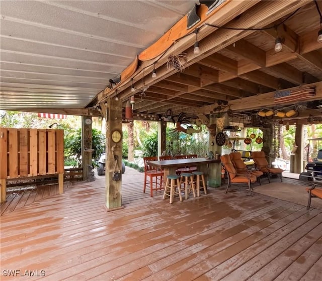 wooden terrace with an outdoor bar