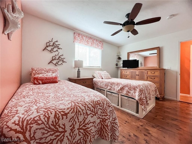 bedroom featuring ceiling fan and dark hardwood / wood-style floors