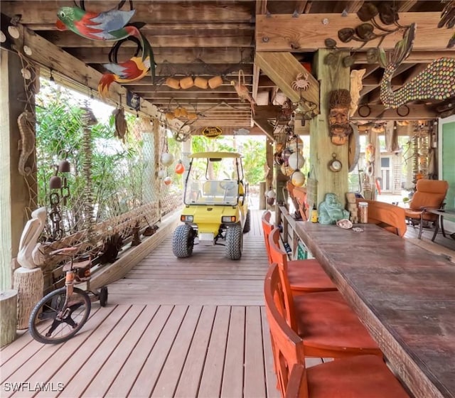 wooden deck featuring an outdoor bar