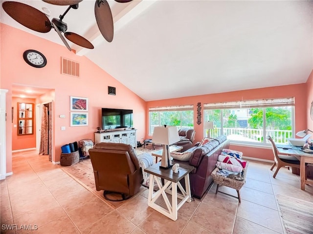 living room with beamed ceiling, ceiling fan, light tile patterned floors, and high vaulted ceiling