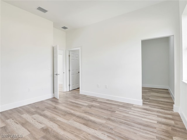 unfurnished room featuring light hardwood / wood-style floors