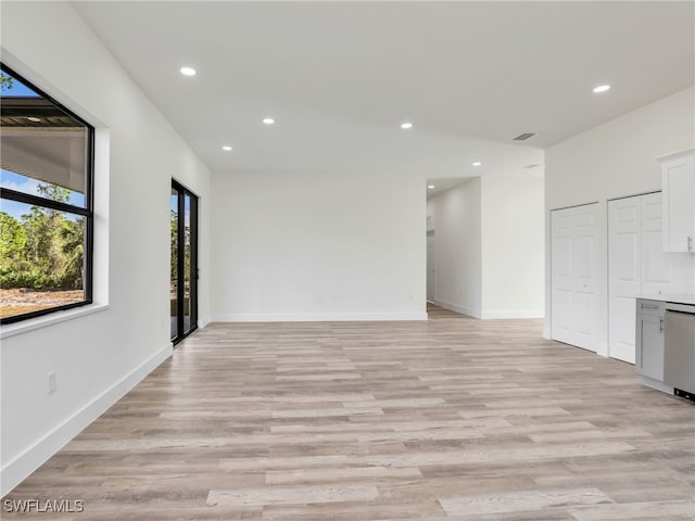 spare room featuring light wood-type flooring