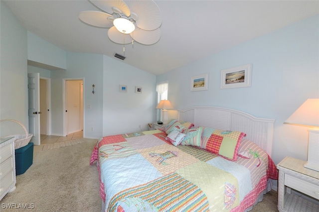 carpeted bedroom featuring ceiling fan and vaulted ceiling