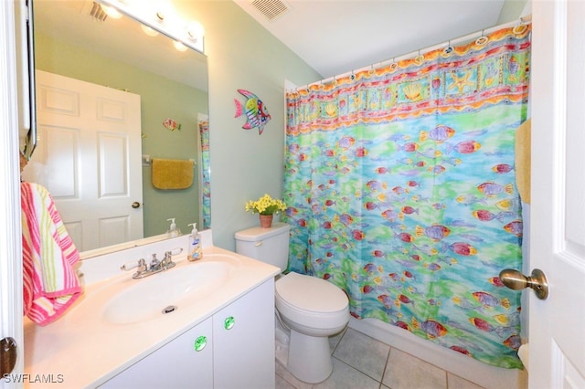 bathroom featuring tile patterned flooring, vanity, a shower with shower curtain, and toilet