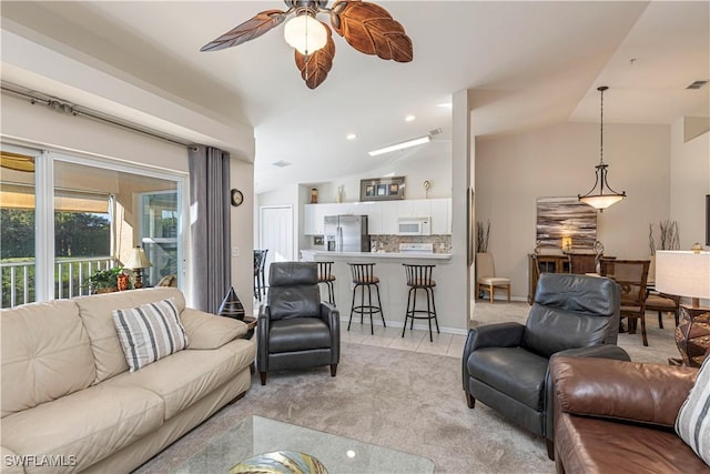 living room with light tile patterned floors, visible vents, light colored carpet, ceiling fan, and vaulted ceiling