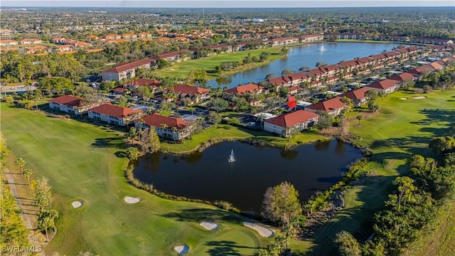 aerial view featuring a residential view, view of golf course, and a water view