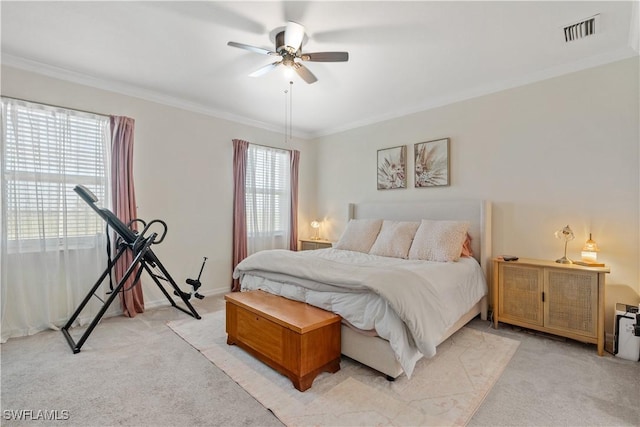 bedroom with light carpet, multiple windows, and ceiling fan