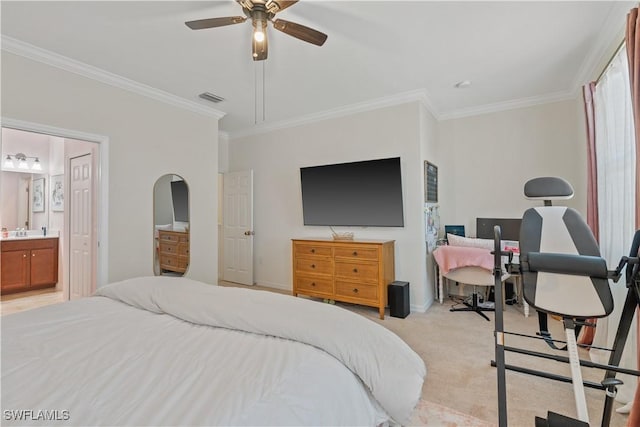 bedroom featuring ceiling fan, ornamental molding, light carpet, and connected bathroom