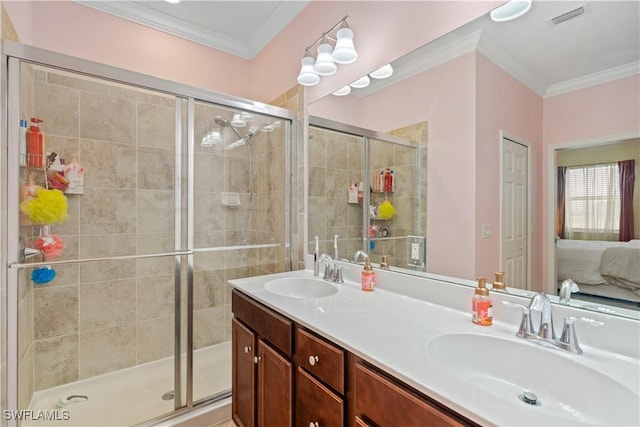 bathroom with vanity, an enclosed shower, and ornamental molding