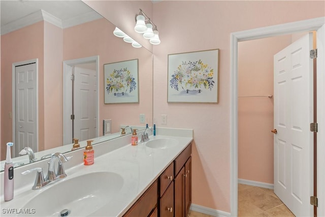 bathroom with tile patterned floors, vanity, and crown molding