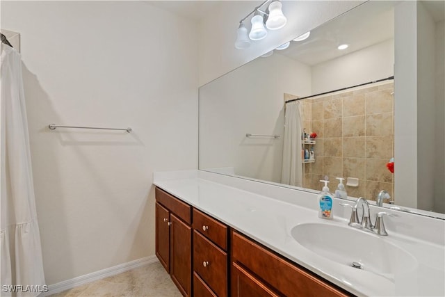 bathroom featuring tile patterned flooring, vanity, and a shower with shower curtain