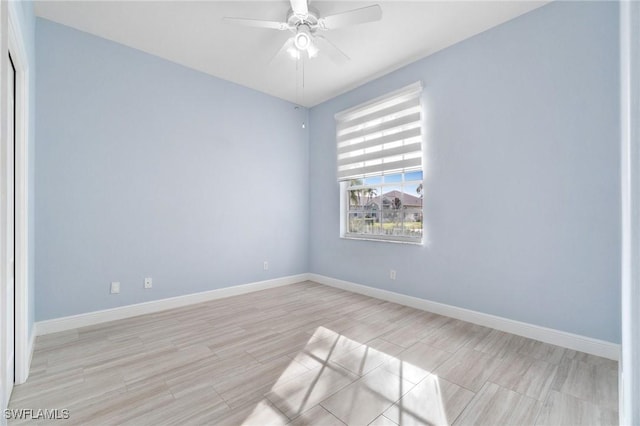 unfurnished room with ceiling fan