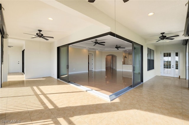 view of patio featuring french doors and ceiling fan