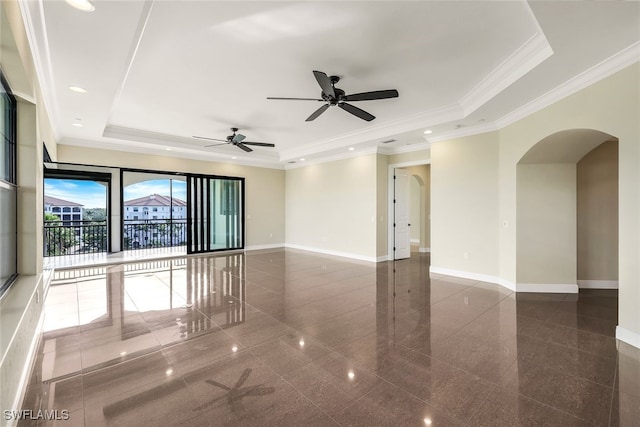 unfurnished room featuring a raised ceiling and crown molding