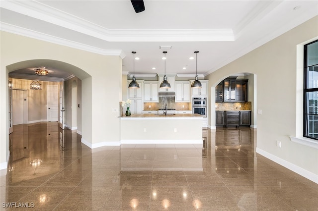 kitchen with tasteful backsplash, ornamental molding, and decorative light fixtures