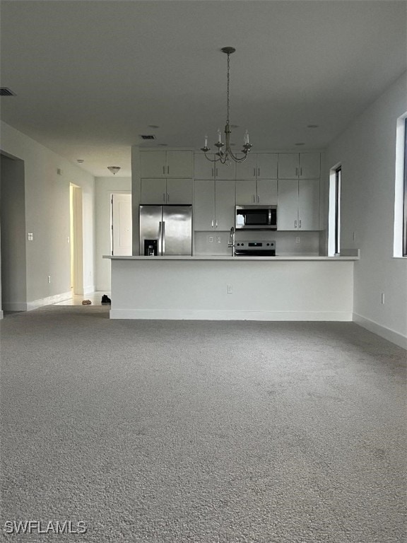 interior space featuring a chandelier and sink