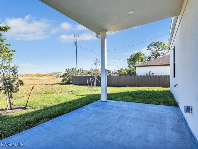 view of patio / terrace featuring fence