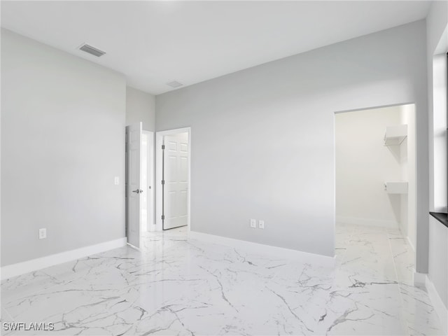 1423 NW 20th Ter, Cape Coral, FL 33993 - unfurnished room featuring light marble finish flooring and baseboards