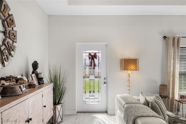 interior space with plenty of natural light and light tile patterned floors