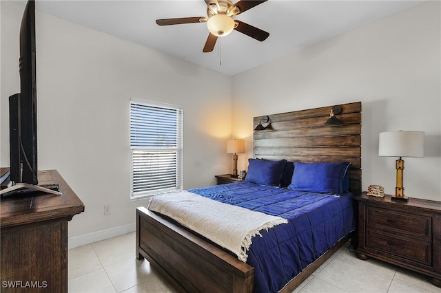 tiled bedroom featuring ceiling fan