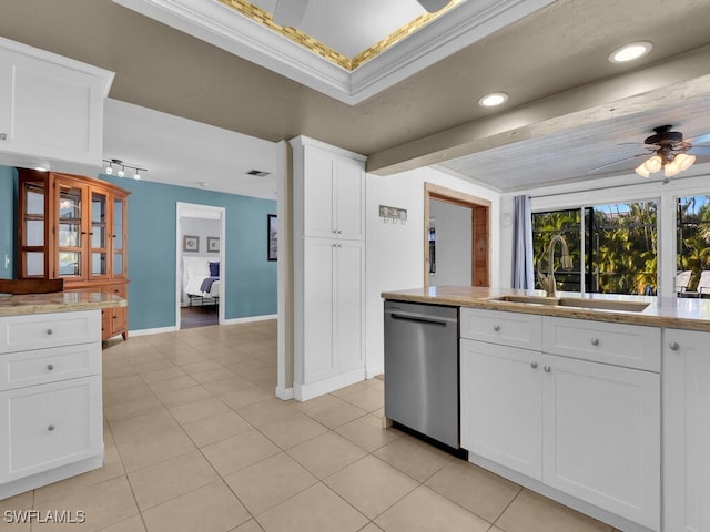 kitchen with dishwasher, white cabinets, sink, ceiling fan, and ornamental molding