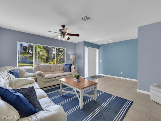 living room with light tile patterned floors and ceiling fan