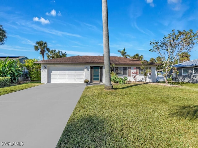 ranch-style home with a front yard and a garage