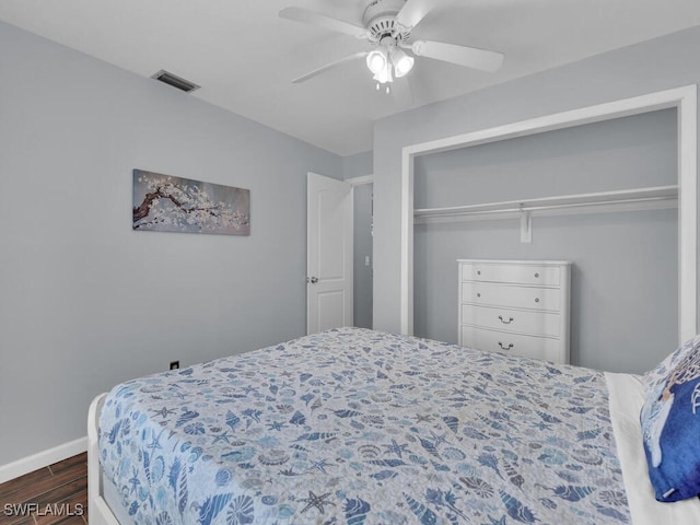 bedroom featuring ceiling fan and a closet