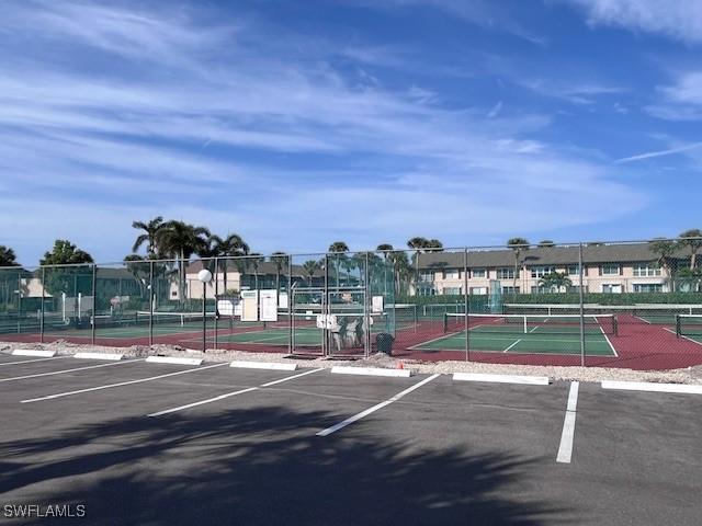 view of tennis court with fence