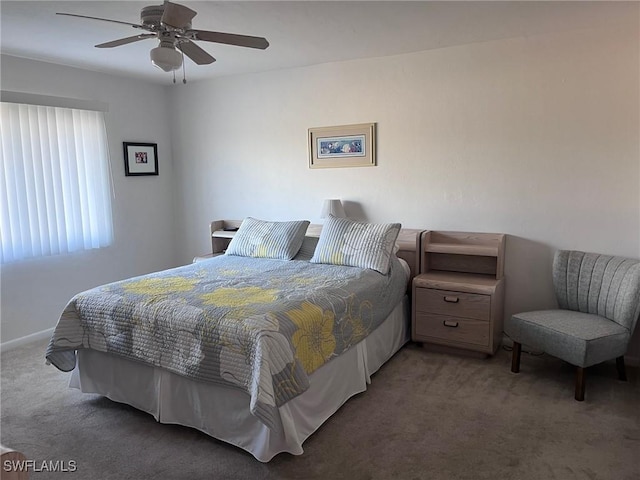 bedroom with a ceiling fan and carpet flooring