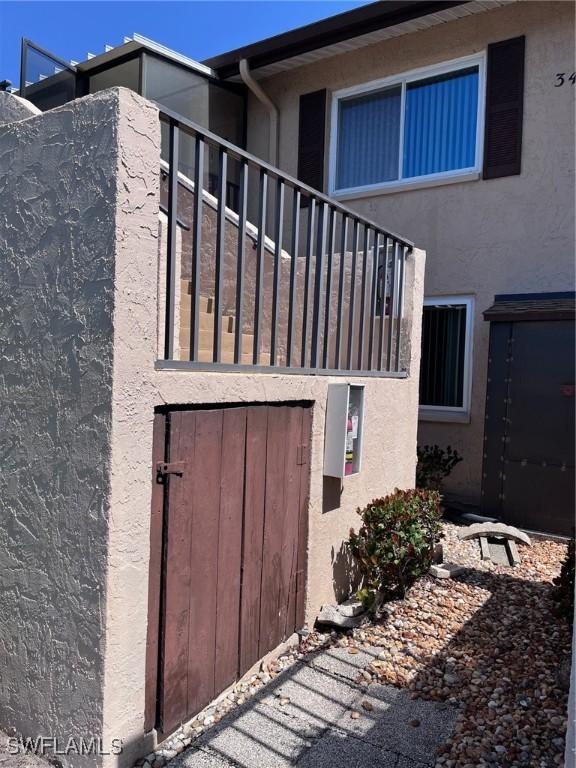 view of side of home featuring stucco siding