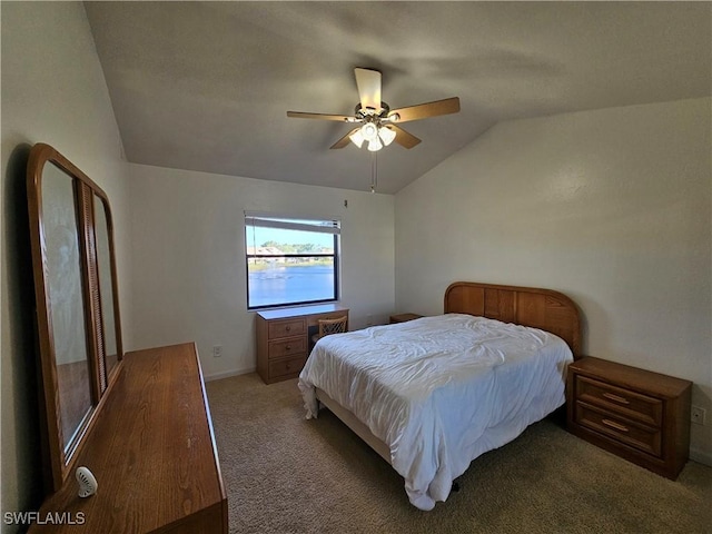 carpeted bedroom featuring vaulted ceiling and ceiling fan