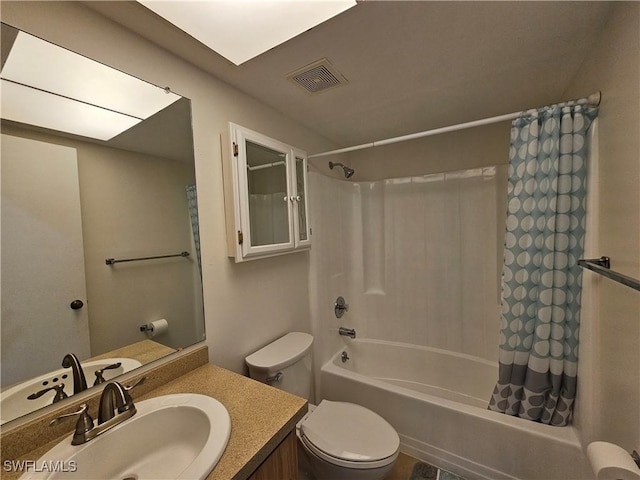 full bathroom with shower / tub combo, vanity, and toilet