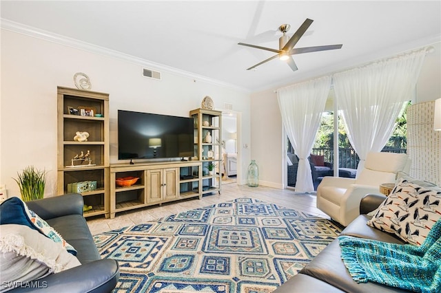 living room with light hardwood / wood-style flooring, ceiling fan, and crown molding