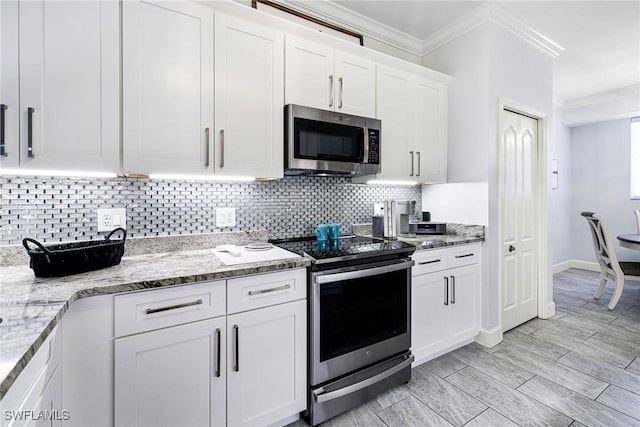 kitchen with backsplash, ornamental molding, light stone counters, white cabinetry, and stainless steel appliances