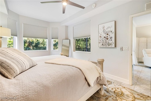 tiled bedroom with ceiling fan