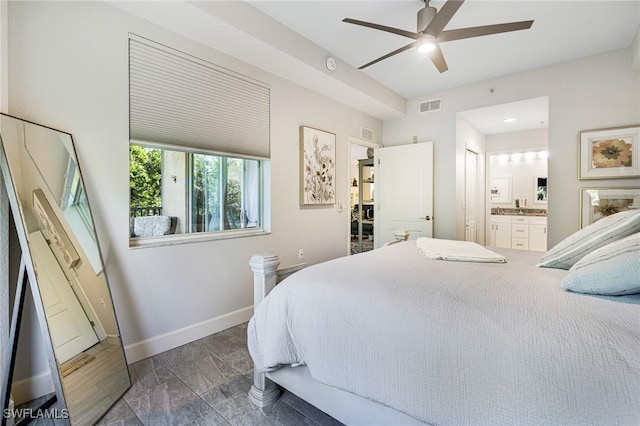 bedroom with ensuite bathroom and ceiling fan