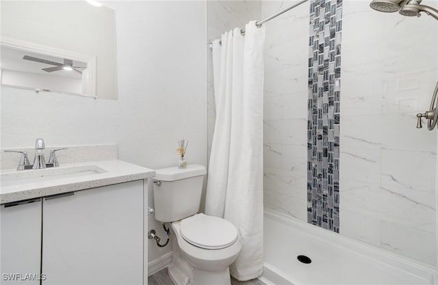 bathroom featuring a shower with curtain, toilet, and vanity