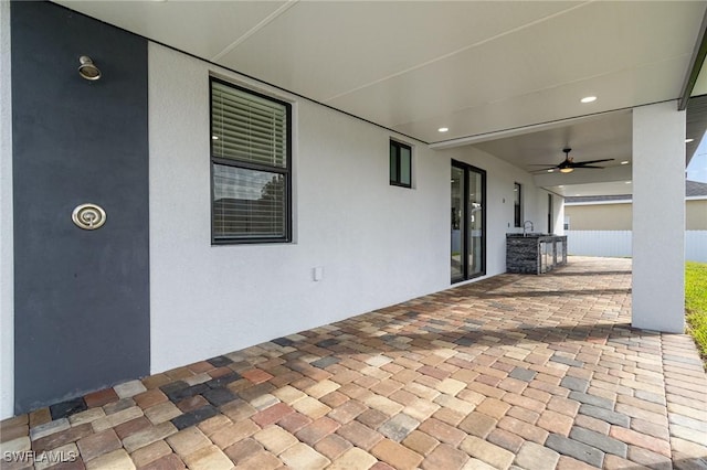 view of patio / terrace featuring ceiling fan and sink