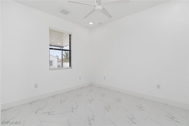 spare room with ceiling fan