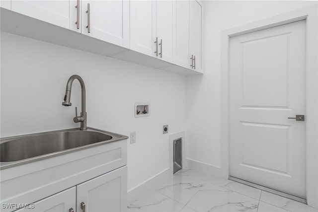 laundry room featuring cabinets, hookup for a washing machine, hookup for an electric dryer, and sink