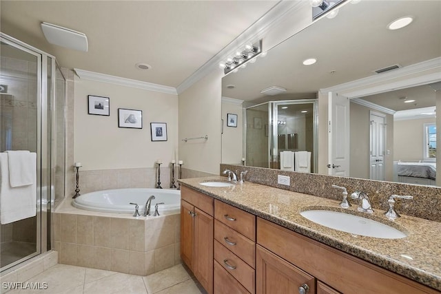 bathroom featuring vanity, tile patterned flooring, plus walk in shower, and ornamental molding