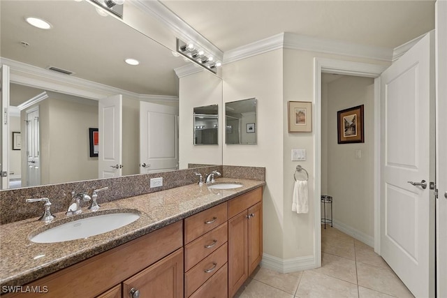 bathroom featuring tile patterned flooring, vanity, and ornamental molding