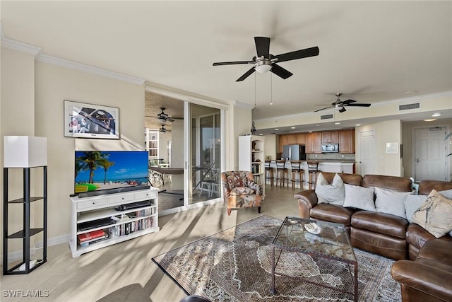 living room featuring crown molding